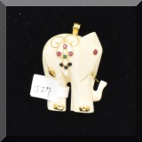 J027. 14K yellow gold bone elephant pendant with red, green and blue stones 1.75” - $65 